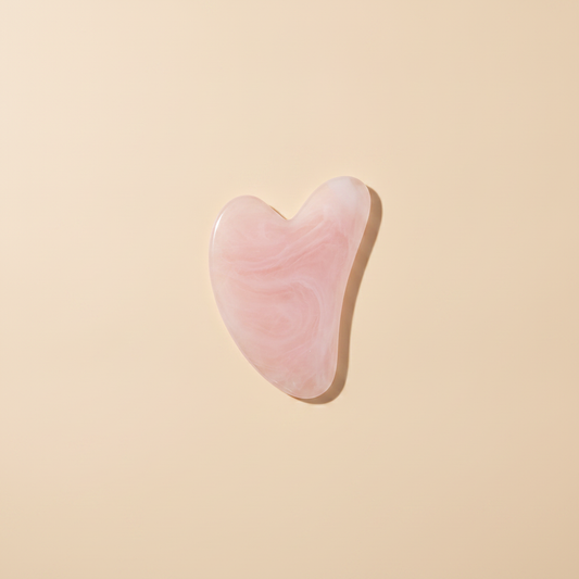 Gua sha viso rosa in quarzo rosa per il massaggio facciale Nuvia